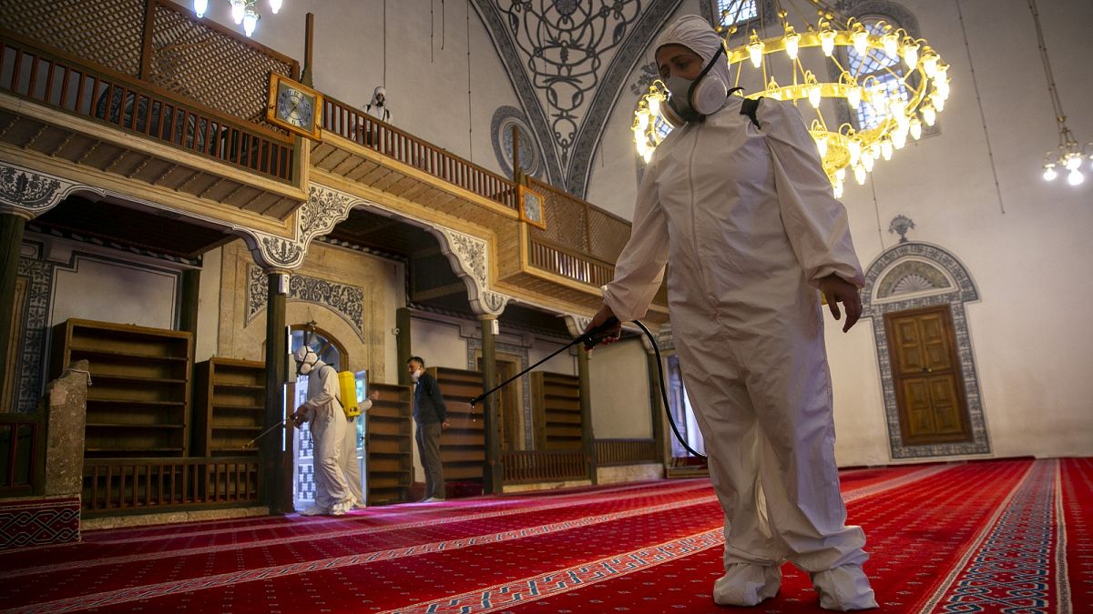 Disinfection team disinfect the premises of the grand mosque in capital Pristina, Kosovo.
