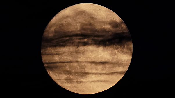 The full moon rises beyond wispy clouds, Sunday, Aug. 2, 2020, in Kansas City, Mo, United States. The full moon rises beyond wispy clouds, Sunday, Aug. 2, 2020, in Kansas City, Mo, United States.