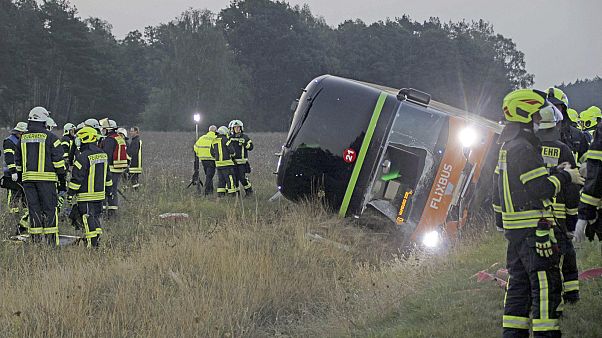 Firefighters are standing next to a long-distance bus on the A24 motorway in Woebbelin, northern Germany. Firefighters are standing next to a long-distance bus on the A24 motorway in Woebbelin, northern Germany.