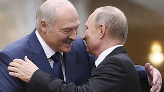 Belarusian President Alexander Lukashenko, left, greets Russian President Vladimir Putin.
