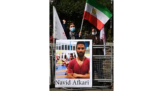 Demonstraters against the execution of Iranian wrestler Navid Afkari gather outside the Iranian embassy in London on September 12, 2020.