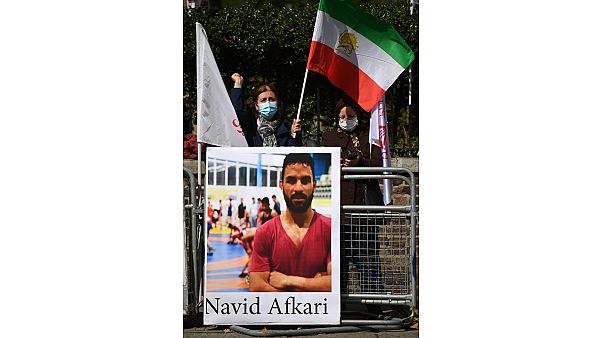 Demonstraters against the execution of Iranian wrestler Navid Afkari gather outside the Iranian embassy in London on September 12, 2020. Demonstraters against the execution of Iranian wrestler Navid Afkari gather outside the Iranian embassy in London on September 12, 2020.