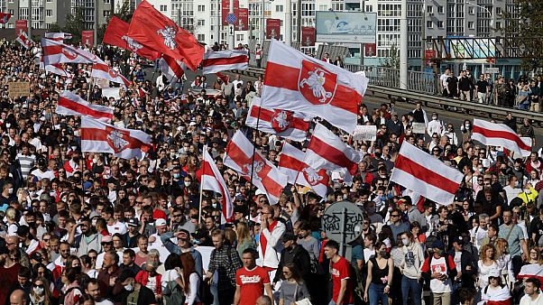 Protesters with old Belarusian national flags march during an opposition supporters' rally protesting election results in Minsk, Belarus. September 13, 2020. Protesters with old Belarusian national flags march during an opposition supporters' rally protesting election results in Minsk, Belarus. September 13, 2020.