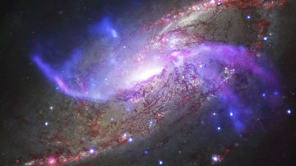 Galaxy NGC 4258, also known as M106, about 23 million light-years away from Earth Galaxy NGC 4258, also known as M106, about 23 million light-years away from Earth