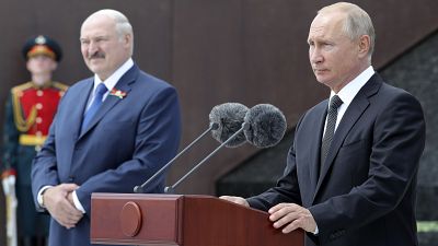 Russian President Vladimir Putin, right, and Belarusian President Alexander Lukashenko at public ceremony, in the village of Khoroshevo, Russia, 30, 2020