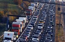 In this Nov. 6, 2017 file photo cars and trucks queue on the highway A5 in Frankfurt, Germany.