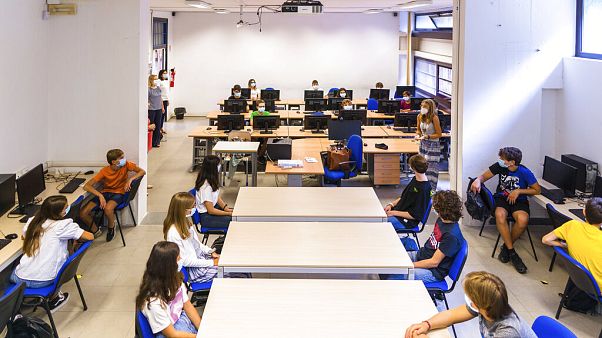 Pupils listen to teachers on their first day of school at the high school Giovanni Battista Morgagni in Rome, Monday, Sept. 14, 2020 Pupils listen to teachers on their first day of school at the high school Giovanni Battista Morgagni in Rome, Monday, Sept. 14, 2020