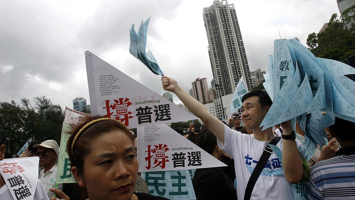 FILE: Thousands of people march in a Hong Kong downtown street, July 1, 2007. 