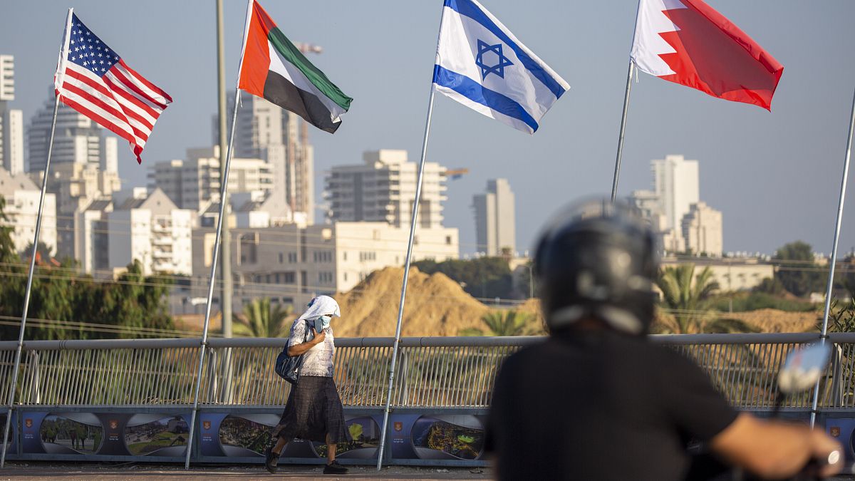 American, United Arab Emirates, Israel and Bahraini flags fly at the Peace Bridge in Netanya, Israel, Monday, Sept. 14, 2020. 