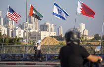 American, United Arab Emirates, Israel and Bahraini flags fly at the Peace Bridge in Netanya, Israel, Monday, Sept. 14, 2020.
