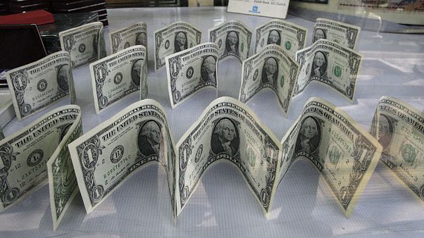 US dollars decorate a foreign currency exchange bureau, in Ferdowsi St. in downtown Tehran, Iran US dollars decorate a foreign currency exchange bureau, in Ferdowsi St. in downtown Tehran, Iran
