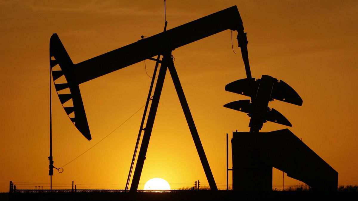  A pumpjack is silhouetted against the setting sun in Oklahoma City