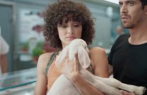 The commercial, featuring a live lamb, asks viewers to 'make the connection' between animals and food.