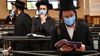 Hasidic Jews wearing face masks to protect against the coronavirus disease observe social distance as they visit the tomb of Rabbi Nahman in Uman, Ukraine, Sept 15, 2020.