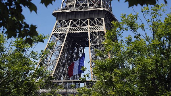 The French national flag decorates the Eiffel Tower The French national flag decorates the Eiffel Tower