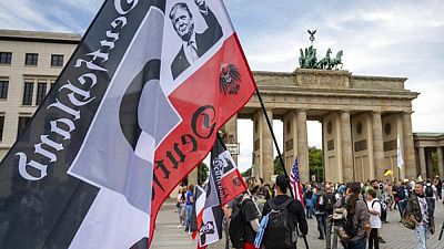 Trump on right-wing extremist flag outside Reichstag in Aug 2020 Trump on right-wing extremist flag outside Reichstag in Aug 2020