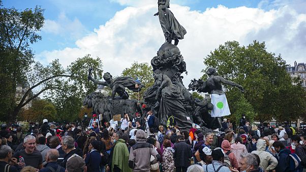 Demonstrators gather during an anti-mask demonstration in Paris Demonstrators gather during an anti-mask demonstration in Paris