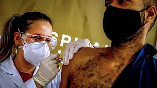 A health worker volunteer receives a COVID-19 vaccine in a trial at the Sao Lucas Hospital, Porto Alegre, Brazil, August 8, 2020. 