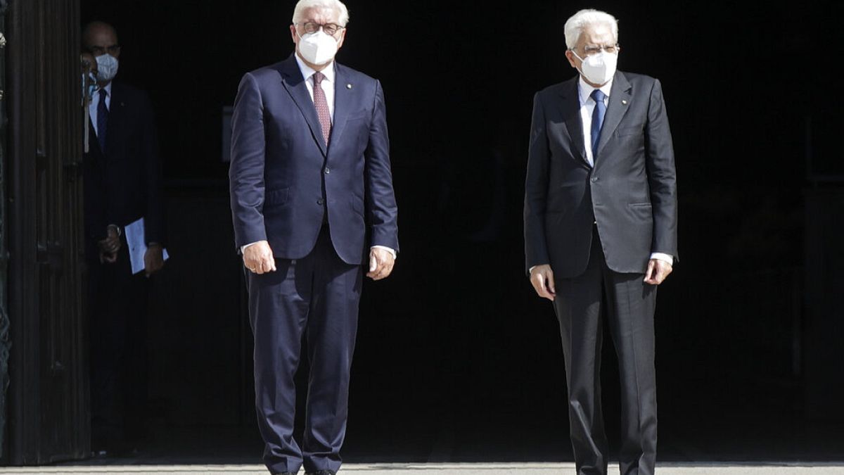German President Frank-Walter Steinmeier, is flanked by Italian President Sergio Mattarella after visiting the Duomo gothic cathedral, in Milan, Italy, Sept. 17, 2020