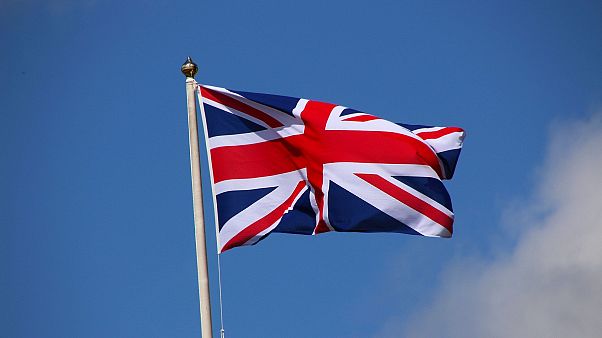 The national flag of the United Kingdom - the Union Jack or Union Flag - flies on a mast. The national flag of the United Kingdom - the Union Jack or Union Flag - flies on a mast.