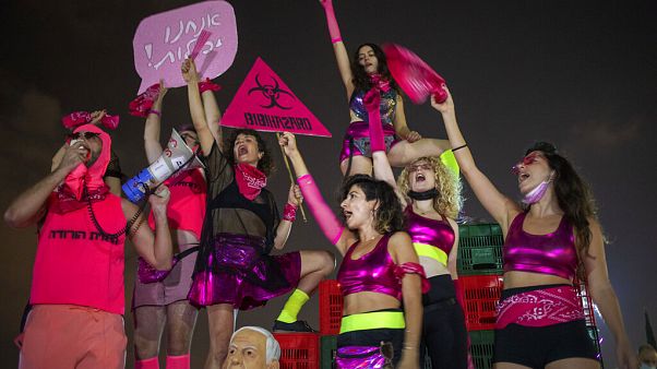 Protesters chanted slogans and held banners against Israeli Prime Minister Benjamin Netanyahu and the coronavirus countrywide lockdown in Tel Aviv on Thursday Protesters chanted slogans and held banners against Israeli Prime Minister Benjamin Netanyahu and the coronavirus countrywide lockdown in Tel Aviv on Thursday