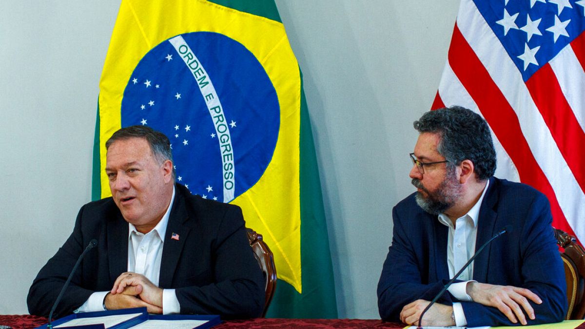 U.S. Secretary of State Mike Pompeo speaks as Brazilian Foreign Minister Ernesto Araujo looks on during a press conference at the Boa Vista Air Base in Roraima, Brazil