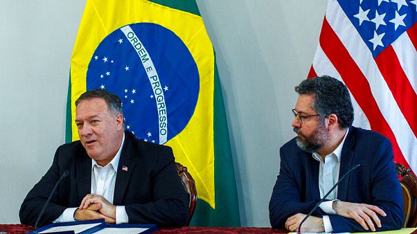 U.S. Secretary of State Mike Pompeo speaks as Brazilian Foreign Minister Ernesto Araujo looks on during a press conference at the Boa Vista Air Base in Roraima, Brazil U.S. Secretary of State Mike Pompeo speaks as Brazilian Foreign Minister Ernesto Araujo looks on during a press conference at the Boa Vista Air Base in Roraima, Brazil