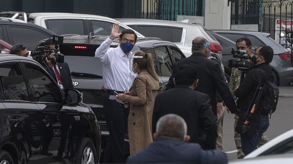 Peru's President Martin Vizcarra greets reporters after addressing Congress in Lima, Peru, Friday, Sept. 18, 2020. Peru's President Martin Vizcarra greets reporters after addressing Congress in Lima, Peru, Friday, Sept. 18, 2020.
