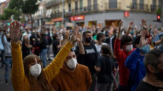 People attend a demonstration at the Vallecas neighborhood in Madrid, on September 20, 2020, to protest against the new restrictive measures.