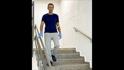 Photo taken from a video showing Alexei Navalny walking down stairs in the Berlin hospital where he is being treated.