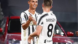 Juventus' Cristiano Ronaldo, left, celebrates his goal with teammate Aaron Ramsey during an Italian Serie A match between Juventus and Sampdoria at the Allianz Arena