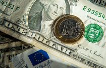 This file photo taken on January 17, 2015 shows euros and US dollar bills taken in Godewaersvelde, Northern France.