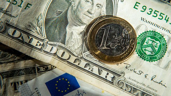 This file photo taken on January 17, 2015 shows euros and US dollar bills taken in Godewaersvelde, Northern France. This file photo taken on January 17, 2015 shows euros and US dollar bills taken in Godewaersvelde, Northern France.
