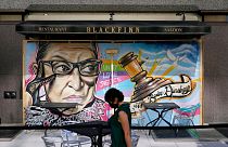 A mural in remembrance of Supreme Court Justice Ruth Bader Ginsburg covers plywood outside Blackfinn Ameripub, Monday, Sept. 21, 2020, in Washington. 