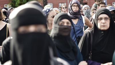 People demonstrate in Copenhagen, Denmark, Wednesday Aug. 1, 2018, as the new ban on garments covering the face is implemented. People demonstrate in Copenhagen, Denmark, Wednesday Aug. 1, 2018, as the new ban on garments covering the face is implemented.