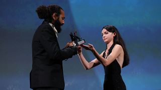 Ismaël El Iraki receives his award at the Venice Film Festival