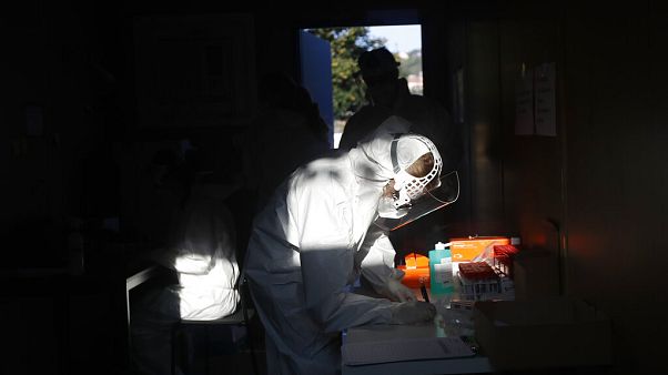 A healthcare worker at a sampling station for COVID-19 in Prague, Czech Republic, Monday, Sept. 21, 2020. A healthcare worker at a sampling station for COVID-19 in Prague, Czech Republic, Monday, Sept. 21, 2020.