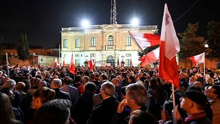 People gather for a protest called by the family of killed journalist Daphne Caruana Galizia and civic movements on December 3, 2019 outside the police HQ in Valletta.