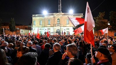 People gather for a protest called by the family of killed journalist Daphne Caruana Galizia and civic movements on December 3, 2019 outside the police HQ in Valletta.