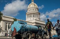Water being delivered to houses opposite the National Capitol Building. Havana, January 4, 2020