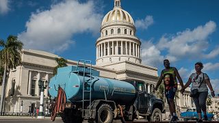 Water being delivered to houses opposite the National Capitol Building. Havana, January 4, 2020