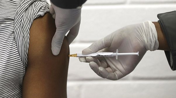 FILE - In this Wednesday, June 24, 2020 file photo, a volunteer receives an injection at the Chris Hani Baragwanath hospital in Soweto, Johannesburg. FILE - In this Wednesday, June 24, 2020 file photo, a volunteer receives an injection at the Chris Hani Baragwanath hospital in Soweto, Johannesburg.