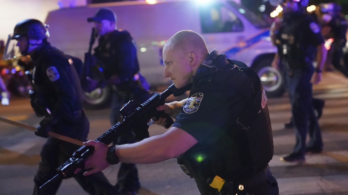 Police move after two Louisville police officers was shot, Wednesday, September 23, 2020, in Louisville, Kentucky.