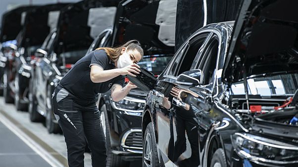 A Mercedes-Benz employee is working on a fuel cap cover for an S-Class at the "Factory 56" plant in Sindelfingen, Germany A Mercedes-Benz employee is working on a fuel cap cover for an S-Class at the "Factory 56" plant in Sindelfingen, Germany