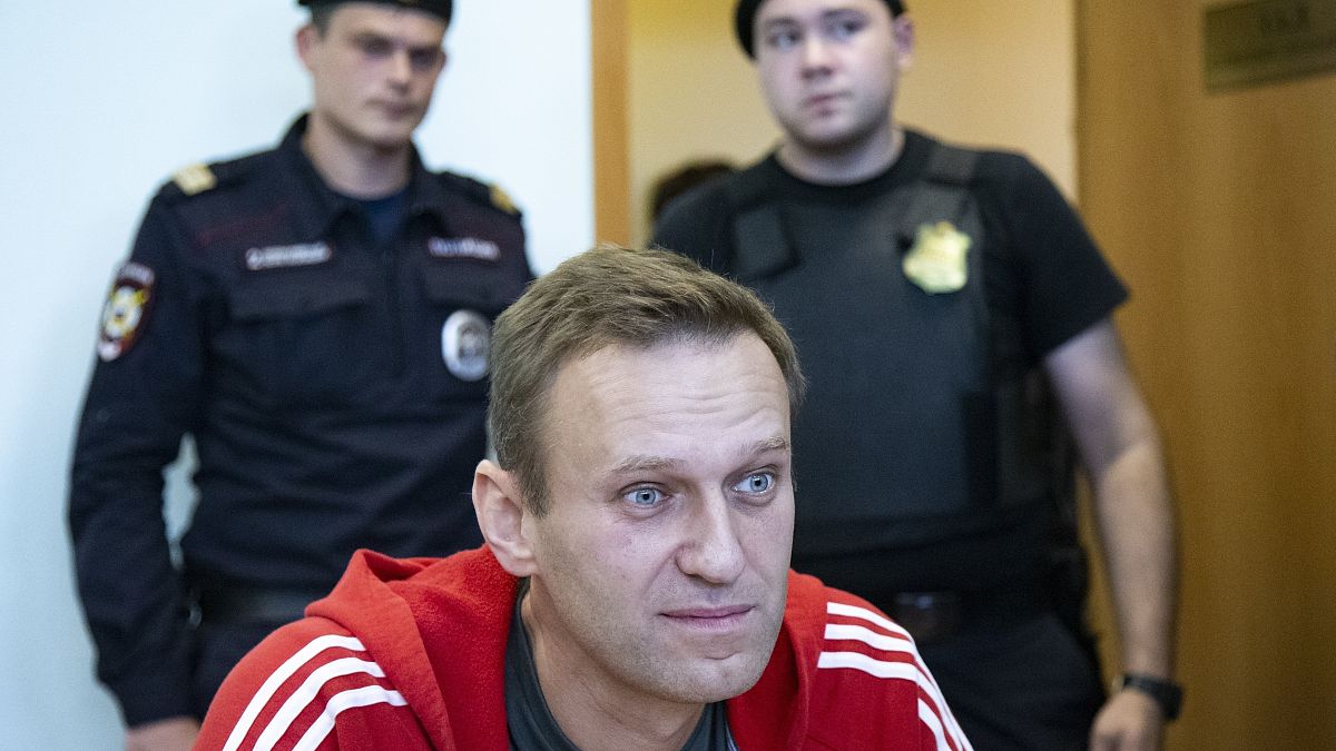Russian opposition leader Alexei Navalny speaks to the media prior to a court session in Moscow, Russia on Aug. 22, 2019.