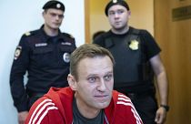 Russian opposition leader Alexei Navalny speaks to the media prior to a court session in Moscow, Russia on Aug. 22, 2019.