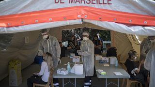 People receive COVID-19 tests at a mobile testing center in Marseille, France, Thursday Sept. 24, 2020.