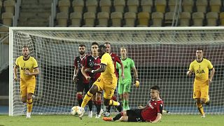 Tottenham's Tanguy Ndombele is takled by Shkendija's Arbin Zejnulai during a Europa League third qualifying round match.