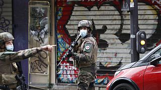French soldiers patrol an area in Paris after four people were injured in a knife attack