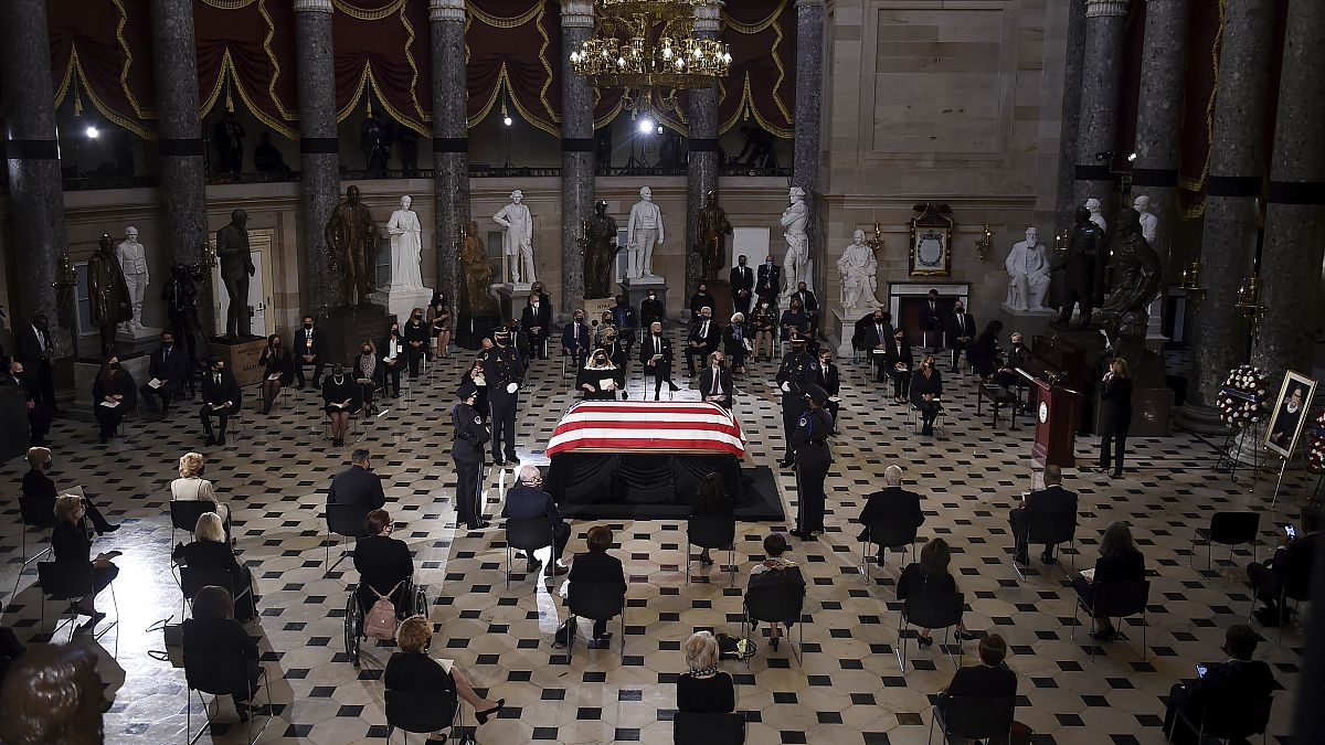 A U.S. Capitol Police honor guard surrounds the flag-draped casket of Justice Ruth Bader Ginsburg as lies in state in Statuary Hall of the U.S. Capitol, Friday, Sept. 25, 2020